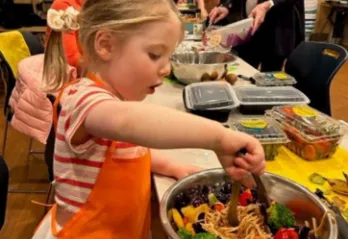 photo of young girl in cooking class