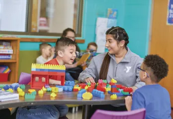 y staff and kids playing with legos