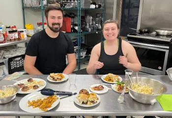 two adults during cooking class