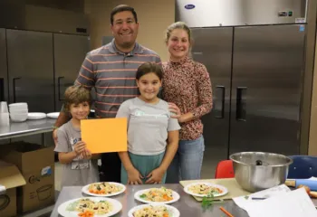 family of four during cooking class