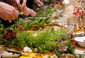 up close image of holiday wreath making