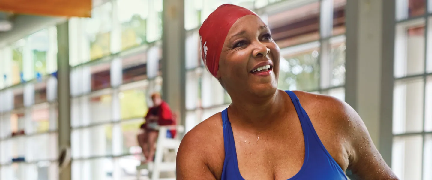 woman in pool smiling