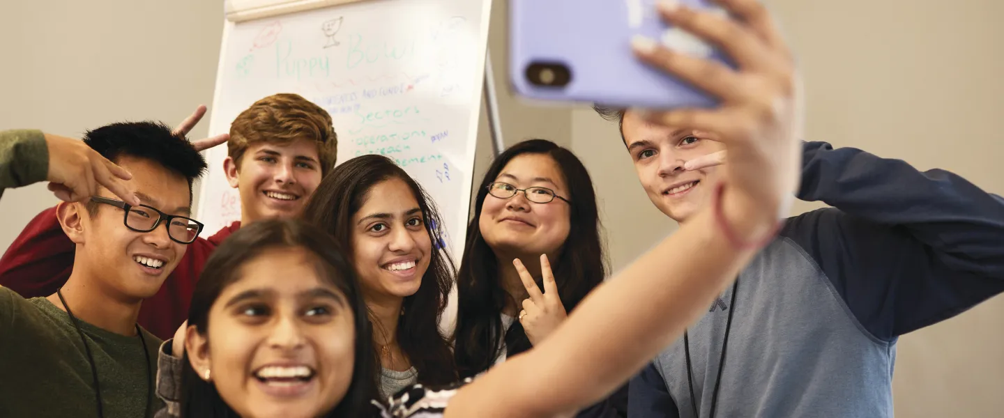 group of teenage friends taking a selfie