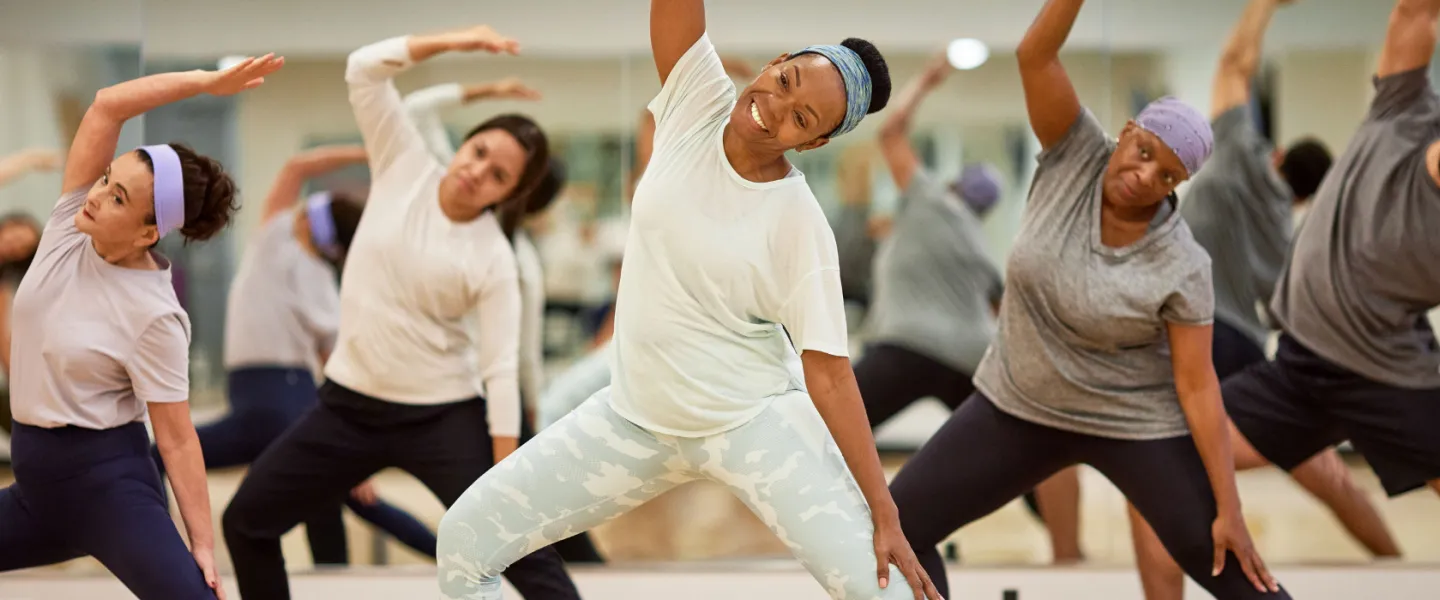 Group exercise class with yoga and dance