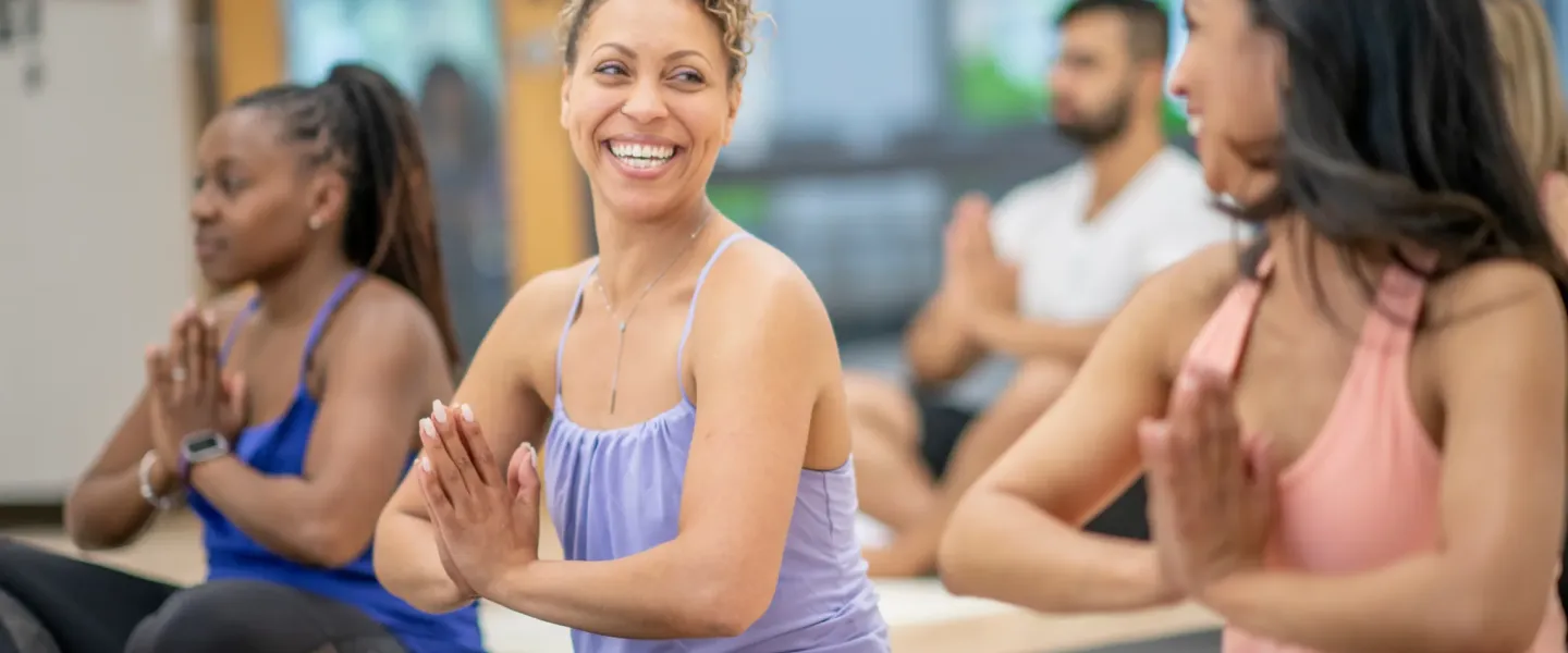 group of ladies practicing yoga