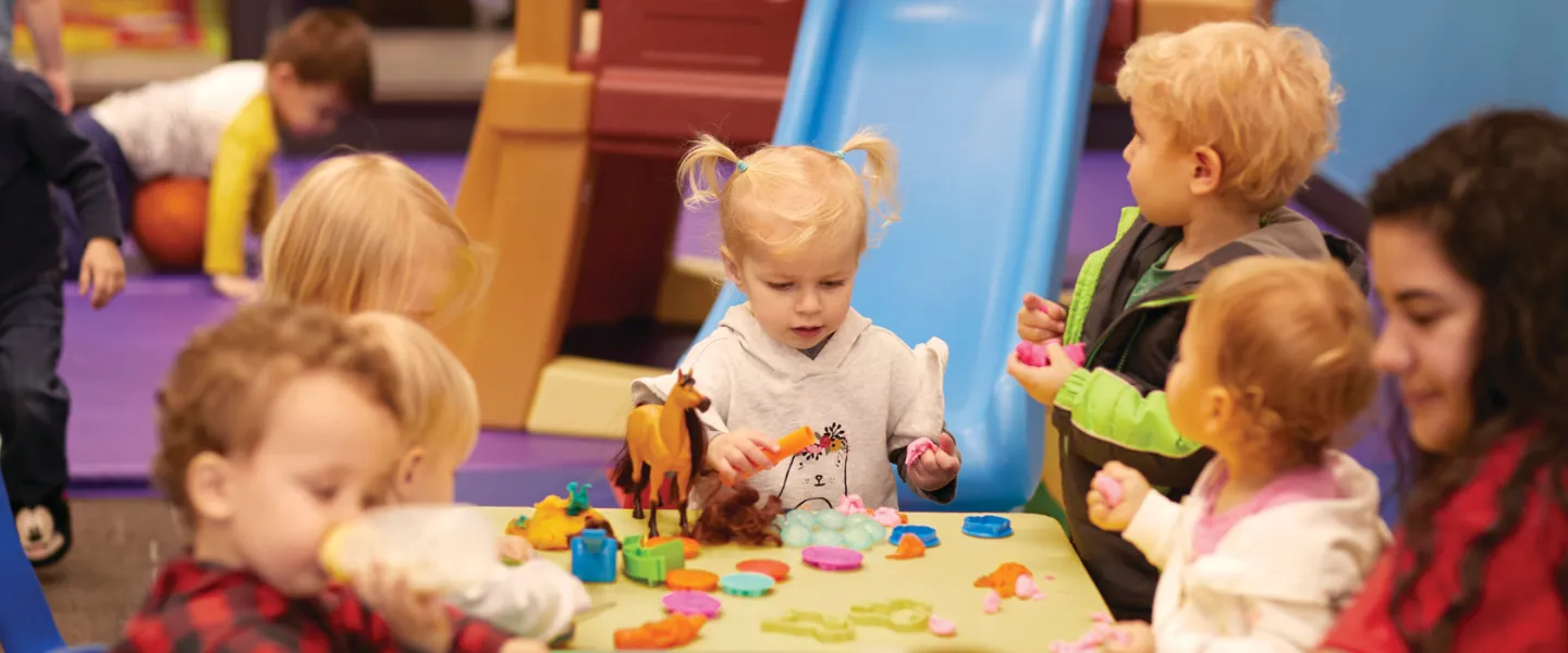 group of toddlers playing and learning