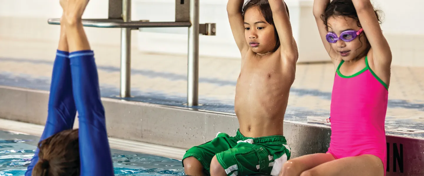 young girl and boy during swim lessons