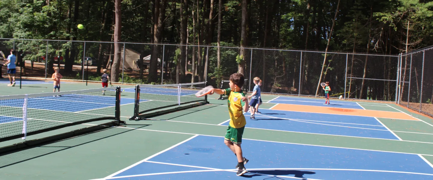 boy playing pickleball