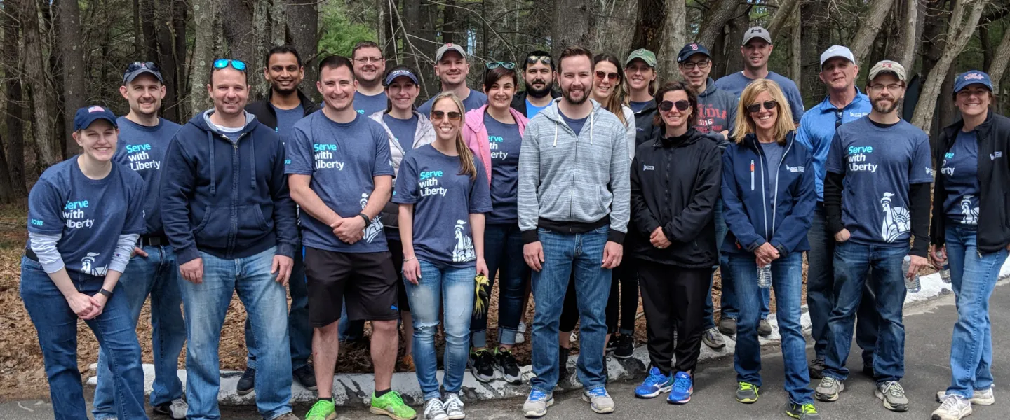 group of volunteers smiling together