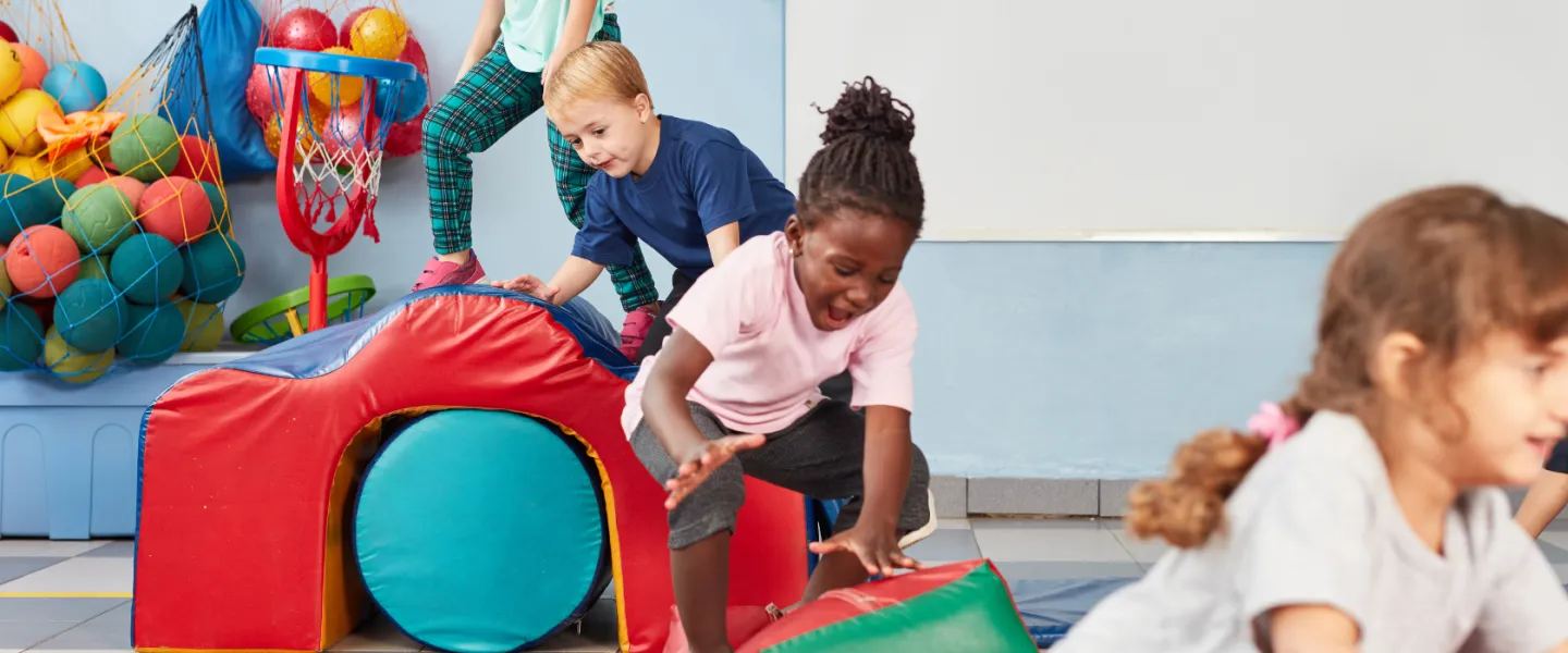 kids playing on gymnastics obstacle course