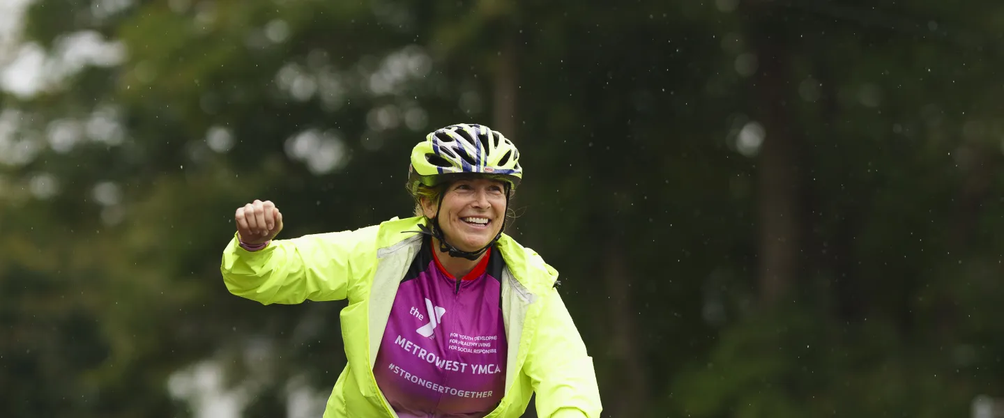 woman on bike participating in the rodman ride for kids