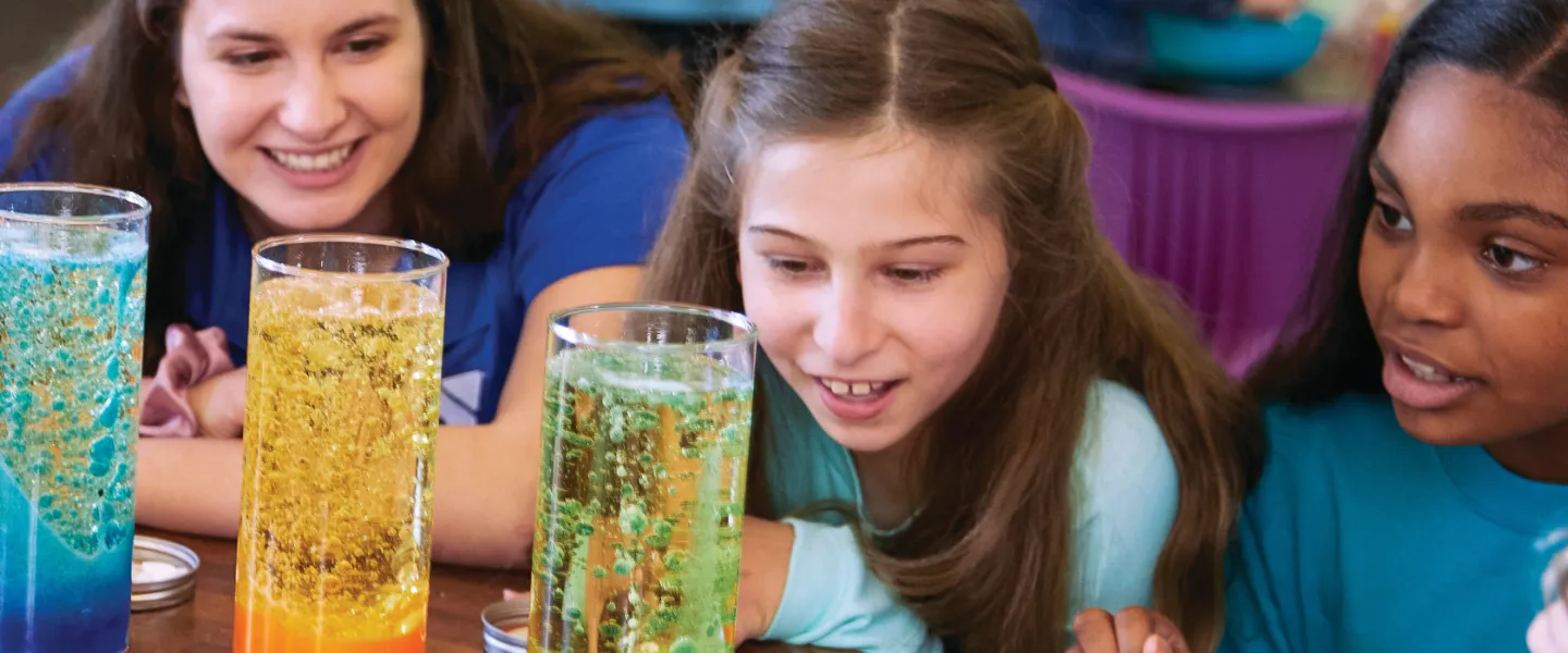 up close image of students looking at science experiment