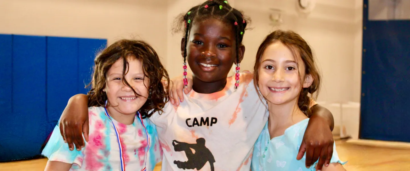 image of three girls smiling at the camera