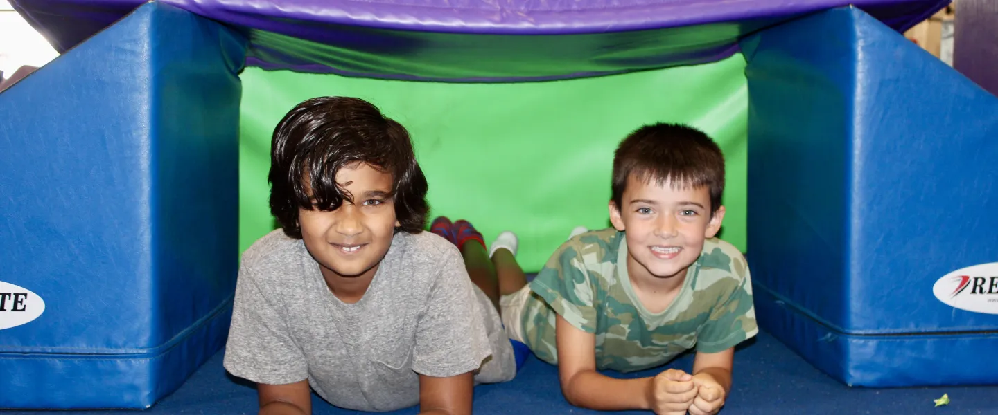 image of two boys on obstacle course