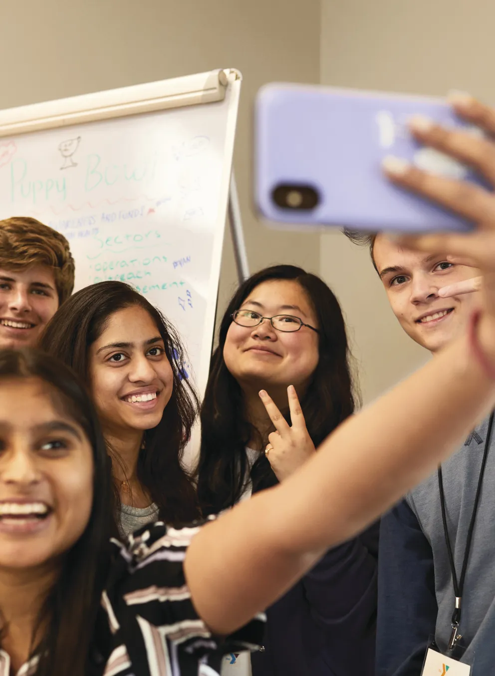 group of teenage friends taking a selfie