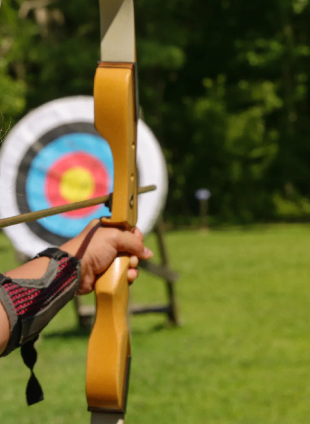 close-up of girl at archery range