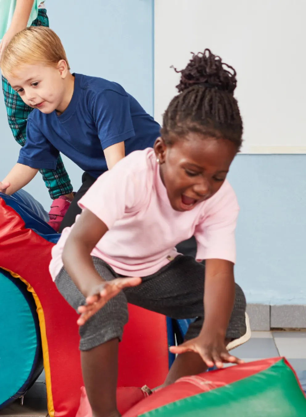 kids playing on gymnastics obstacle course