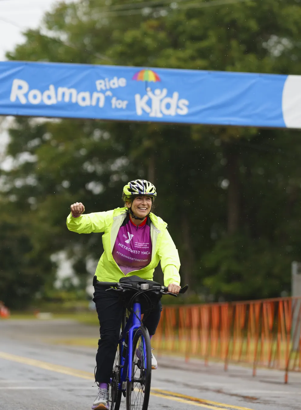 woman on bike participating in the rodman ride for kids