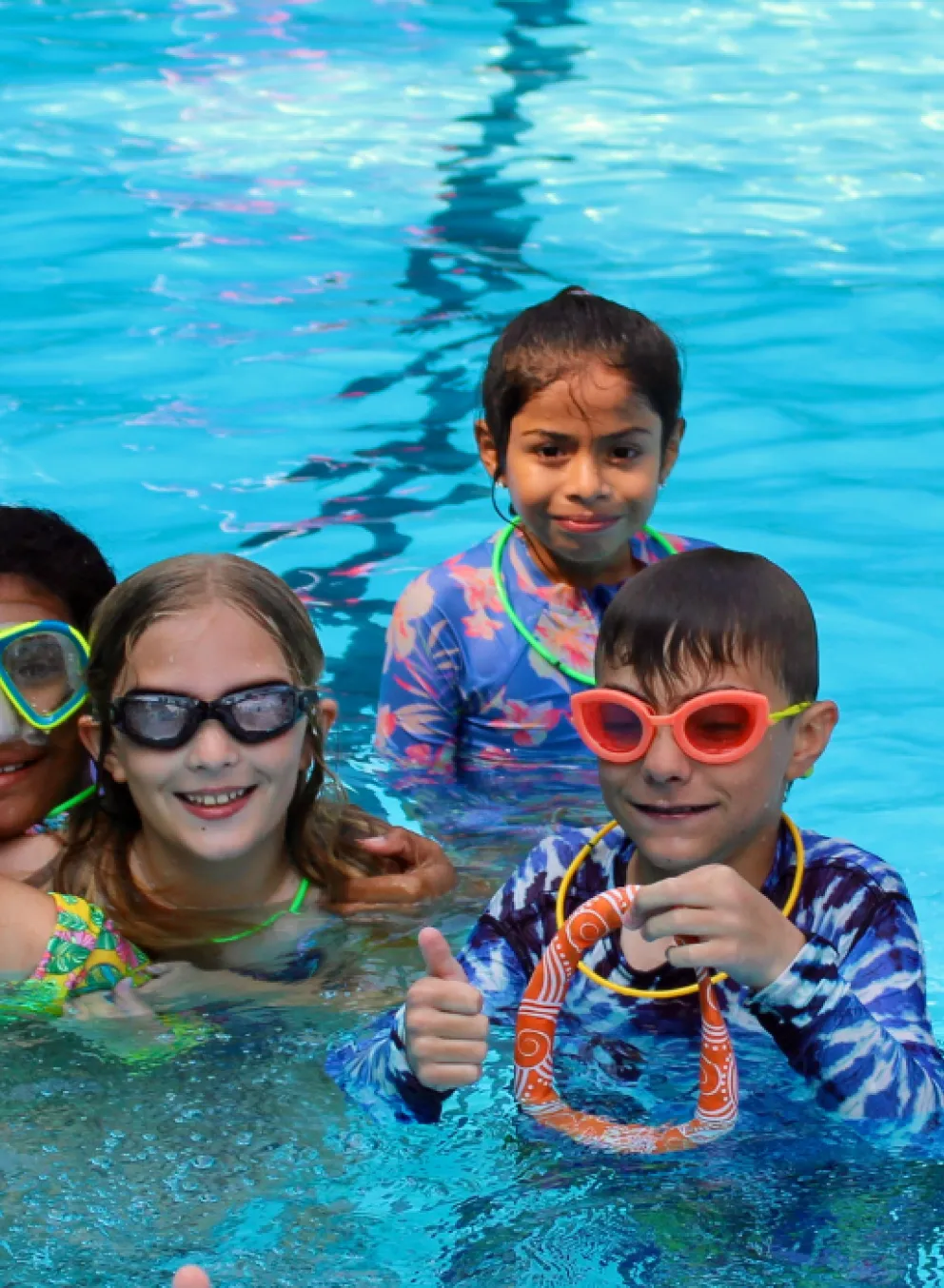 group photo of campers in the pool