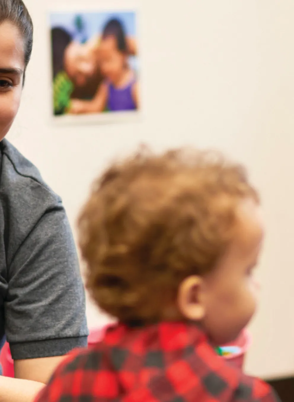 image of teacher reading to toddlers