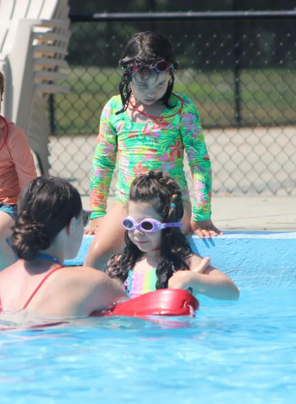 image of young kids at the pool with lifeguard