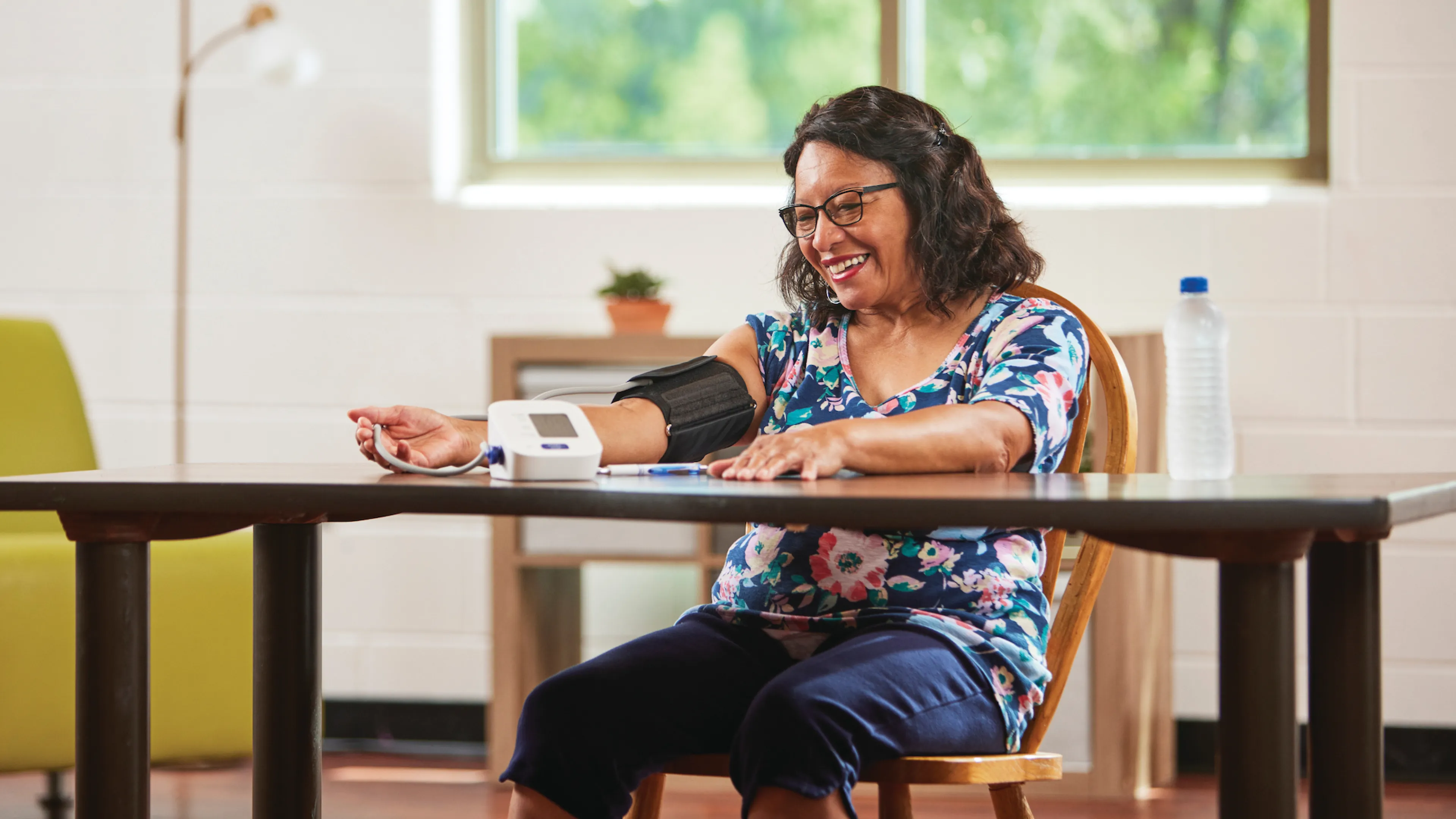 woman taking her blood pressure
