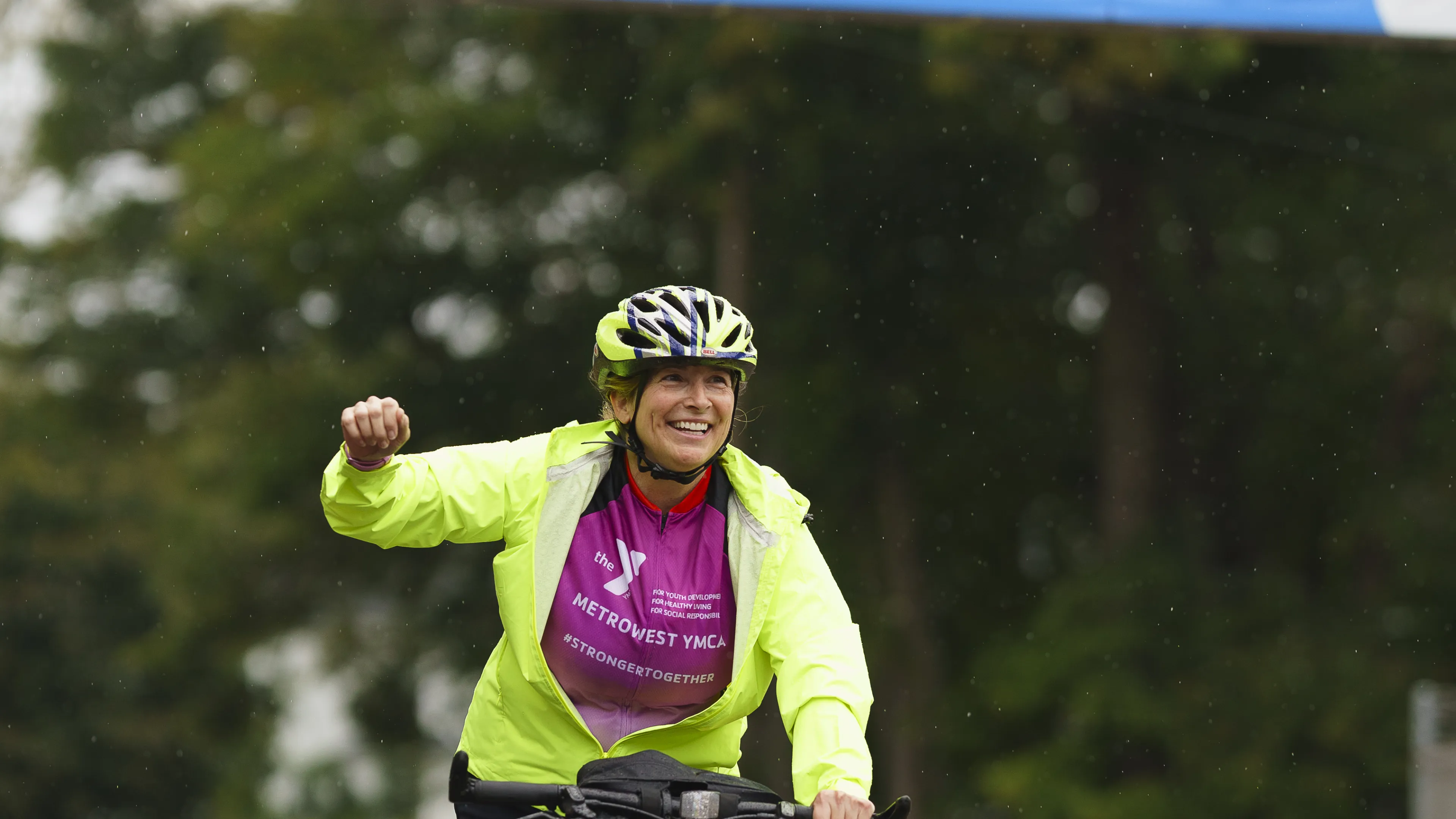 woman on bike participating in the rodman ride for kids