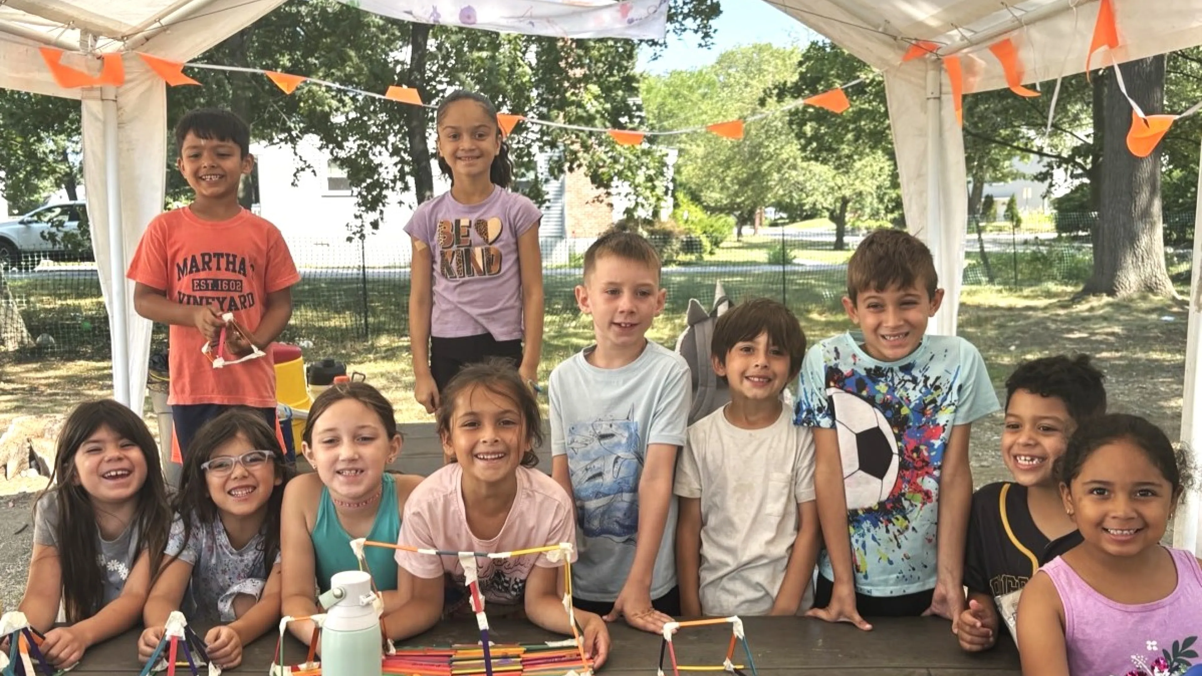 group of campers smiling at the camera
