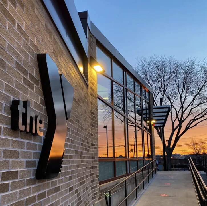 sunset reflecting in the window of the Framingham Branch y