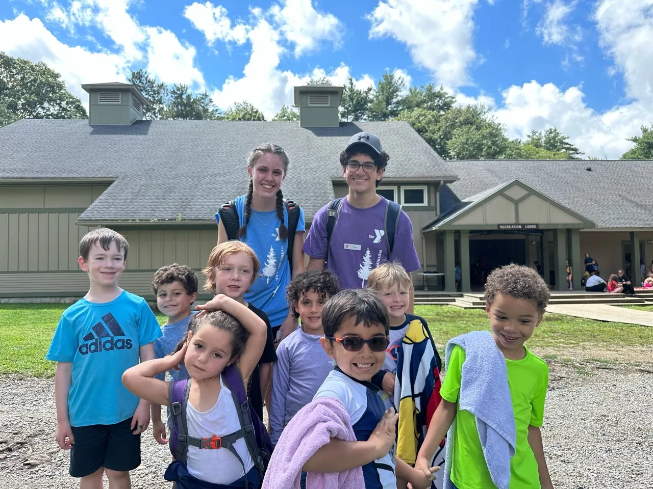 group photo of young campers and two camp counselors