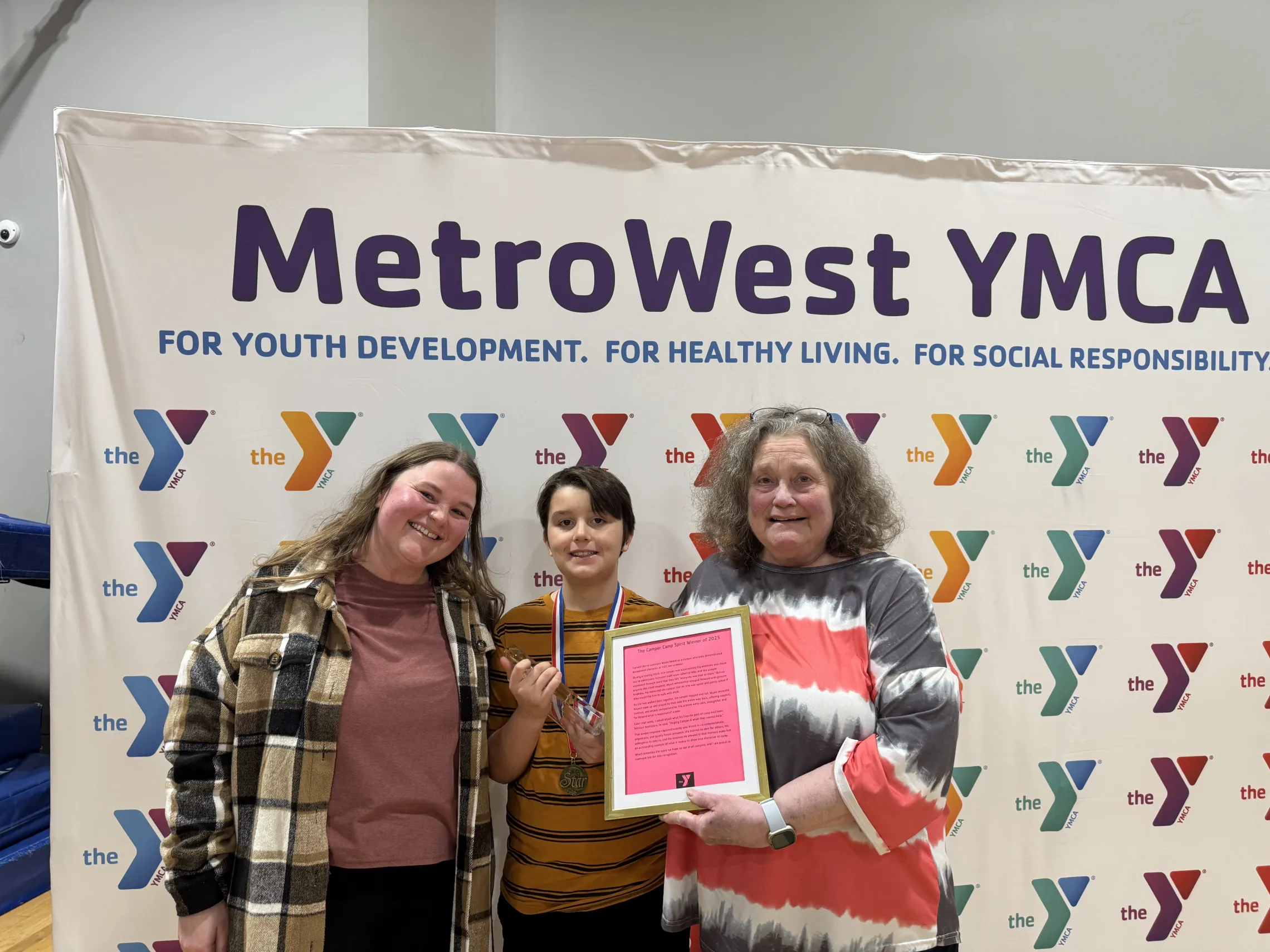 camper smiling for photo with family members