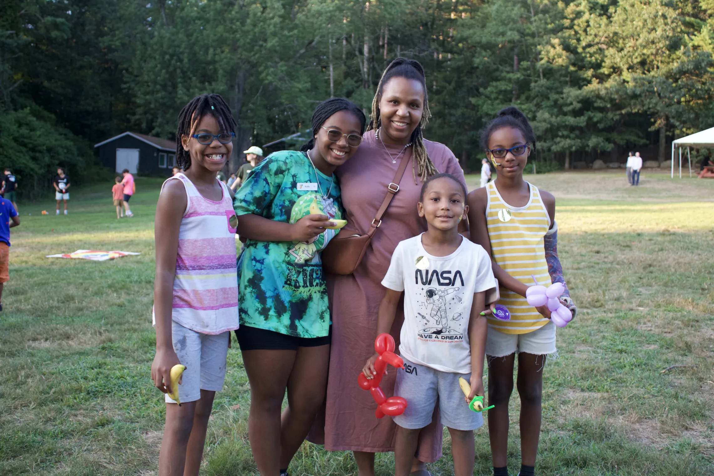 family photo taken outside in the summer