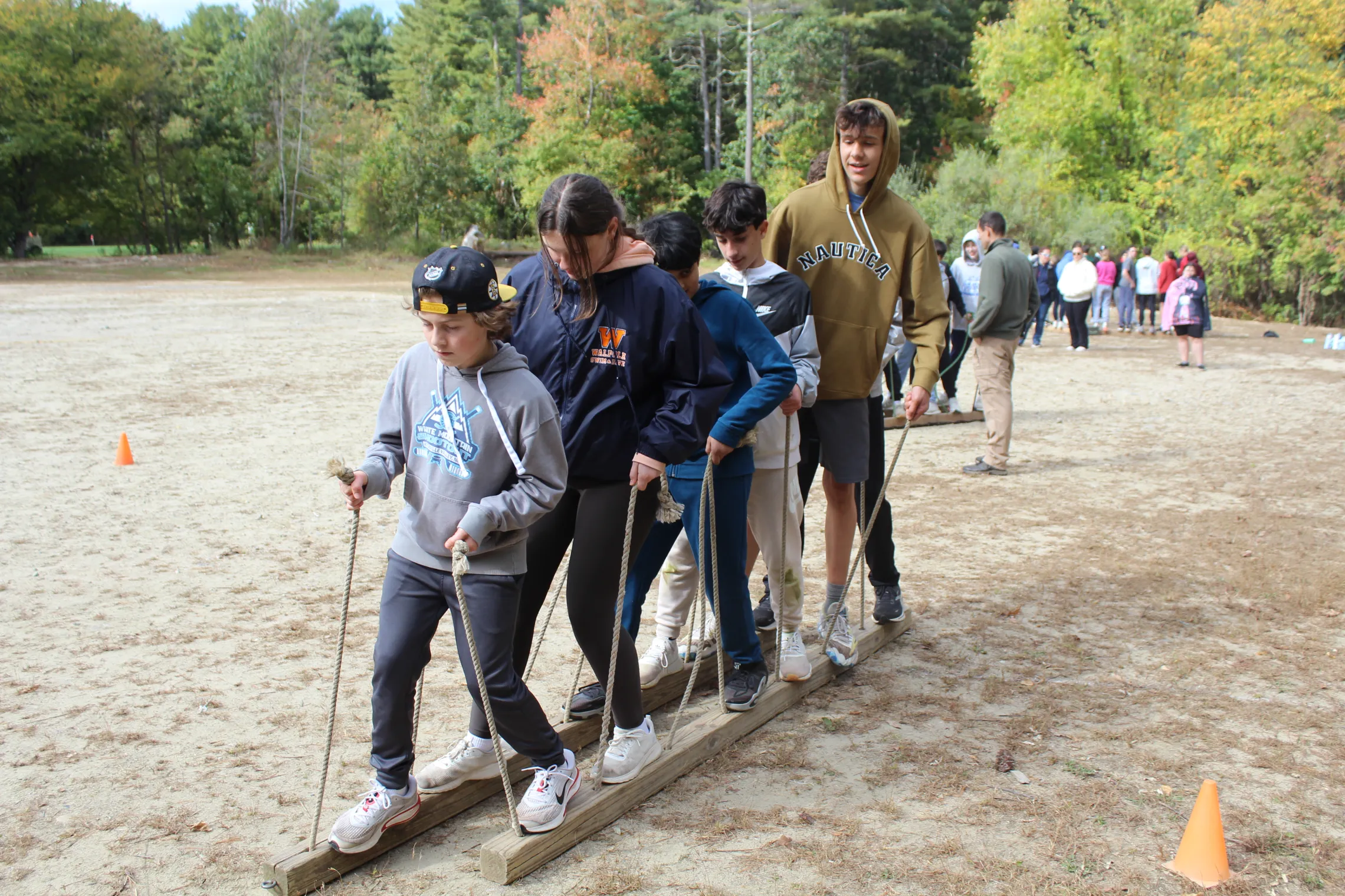 group of school kids participating in team building activity