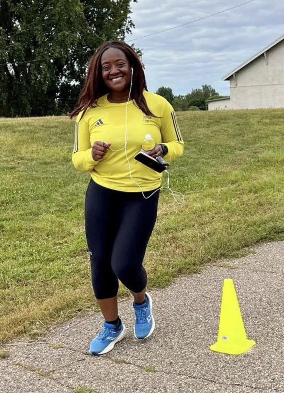 female runner in bright yellow
