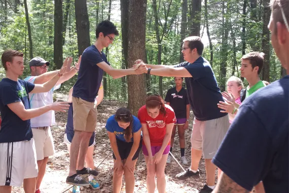 group of college kids participating in team building activity