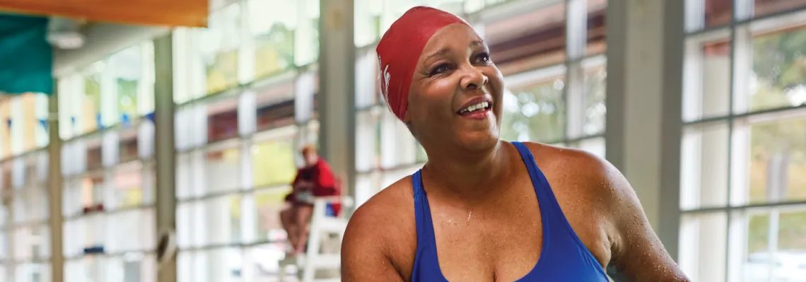 woman in pool smiling