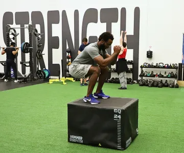 Man jumping on vertical leap in wellness center