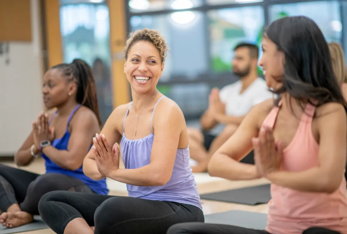 group of ladies practicing yoga