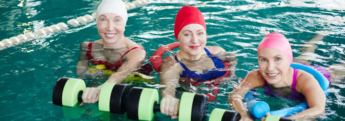 three adult women in the pool