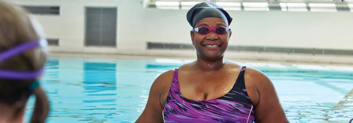 adult female wearing goggles in the pool