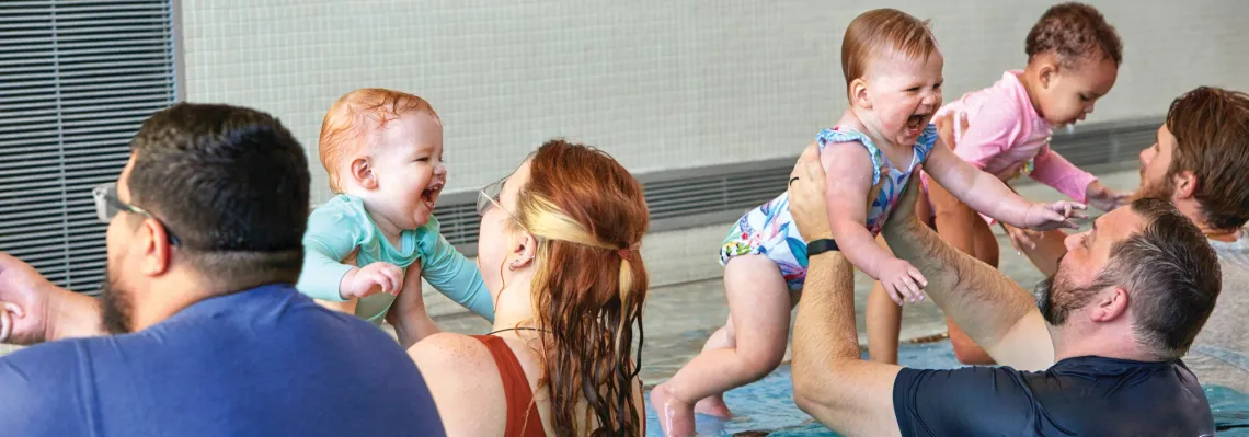 parents and babies during swim lessons