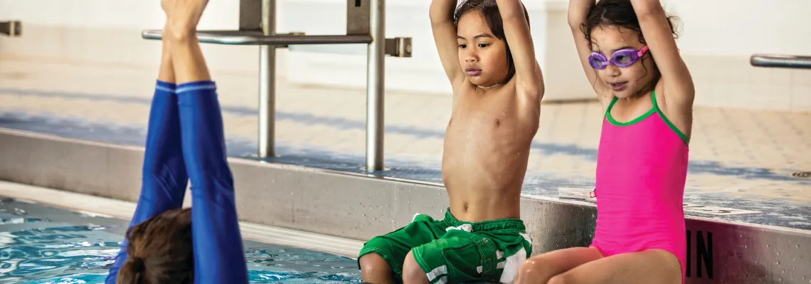 young girl and boy during swim lessons