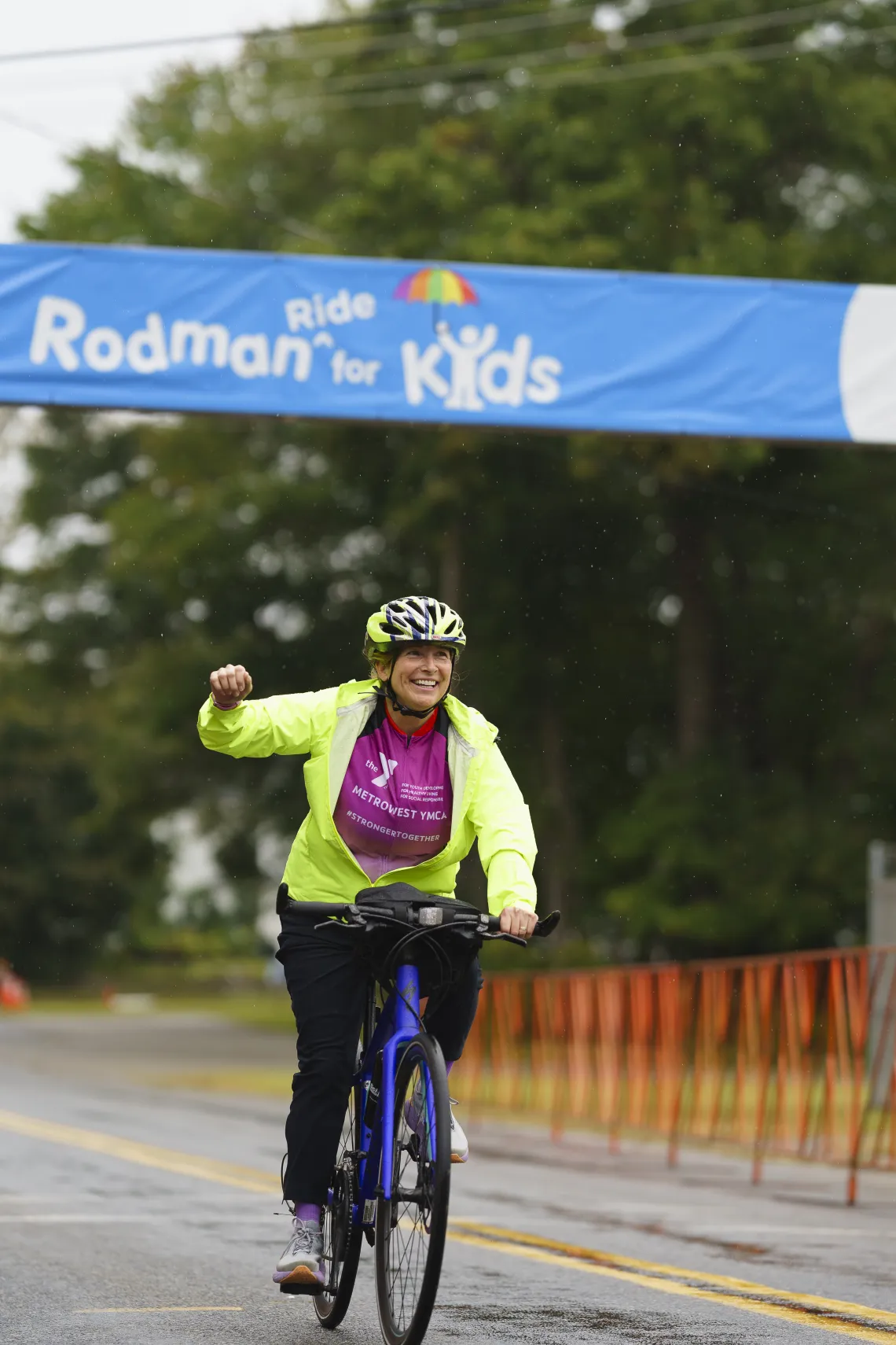 woman on bike participating in the rodman ride for kids