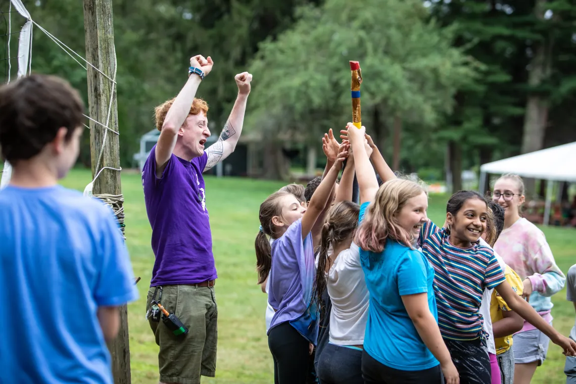 campers and counselor celebrating