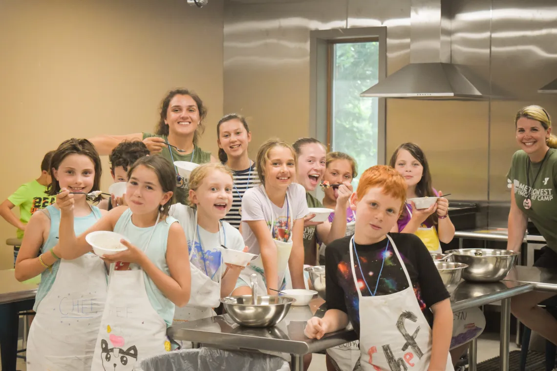 image of a group of kids in the kitchen with bowls