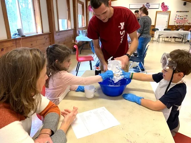 image of y staff member making slime with kids