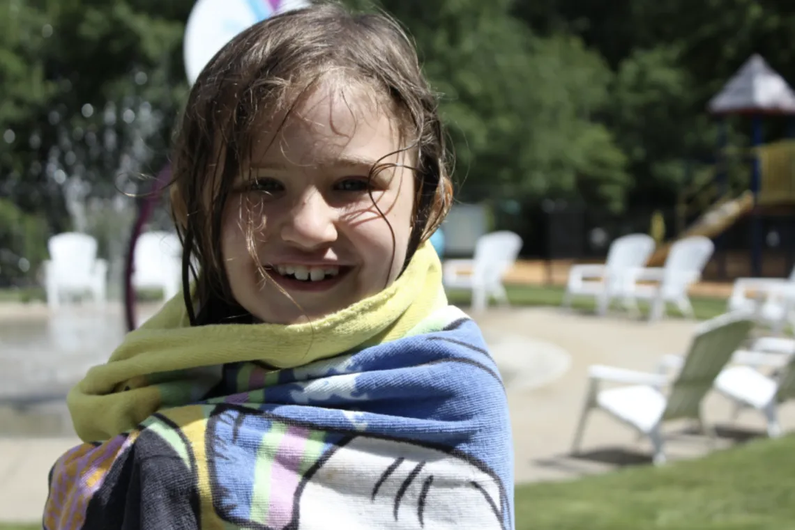 up close shot of young girl smiling at the camera