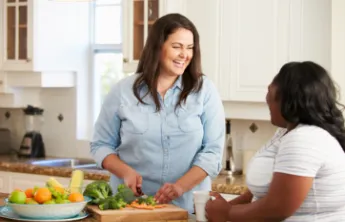 Two women prepare a healthy lunch