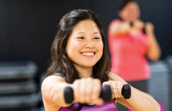 woman exercising with dumbbells