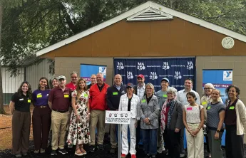 A group of state leaders in the education and agriculture space gather at the MetroWest YMCA Outdoor Center for a Farm-to-School demonstration